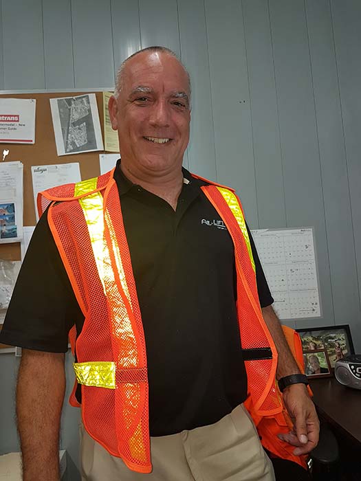 Man wearing ALL-LIFT golf shirt